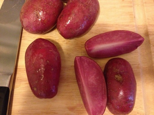 Pink heirloom potatoes picked up at the farmers' market. Delicious and a great color to get one particular child to try them ;).